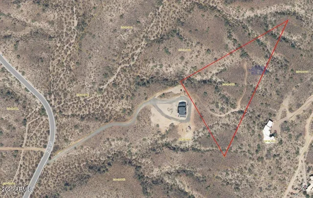 a view of a dry yard with mountain