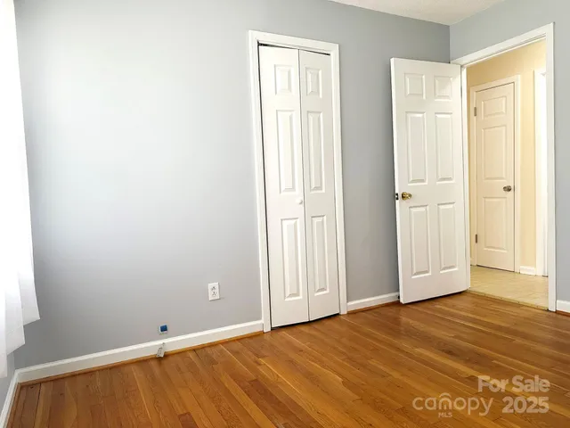 a view of wooden floor in an empty room