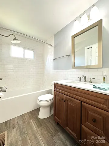 a view of a kitchen with wooden floor and cabinet