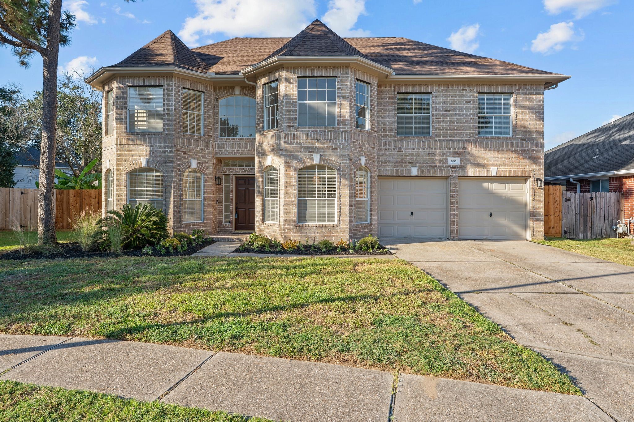 810 Flanners Court Spring, TX 77373 - Photo 3 of 46 a front view of a house with a garden