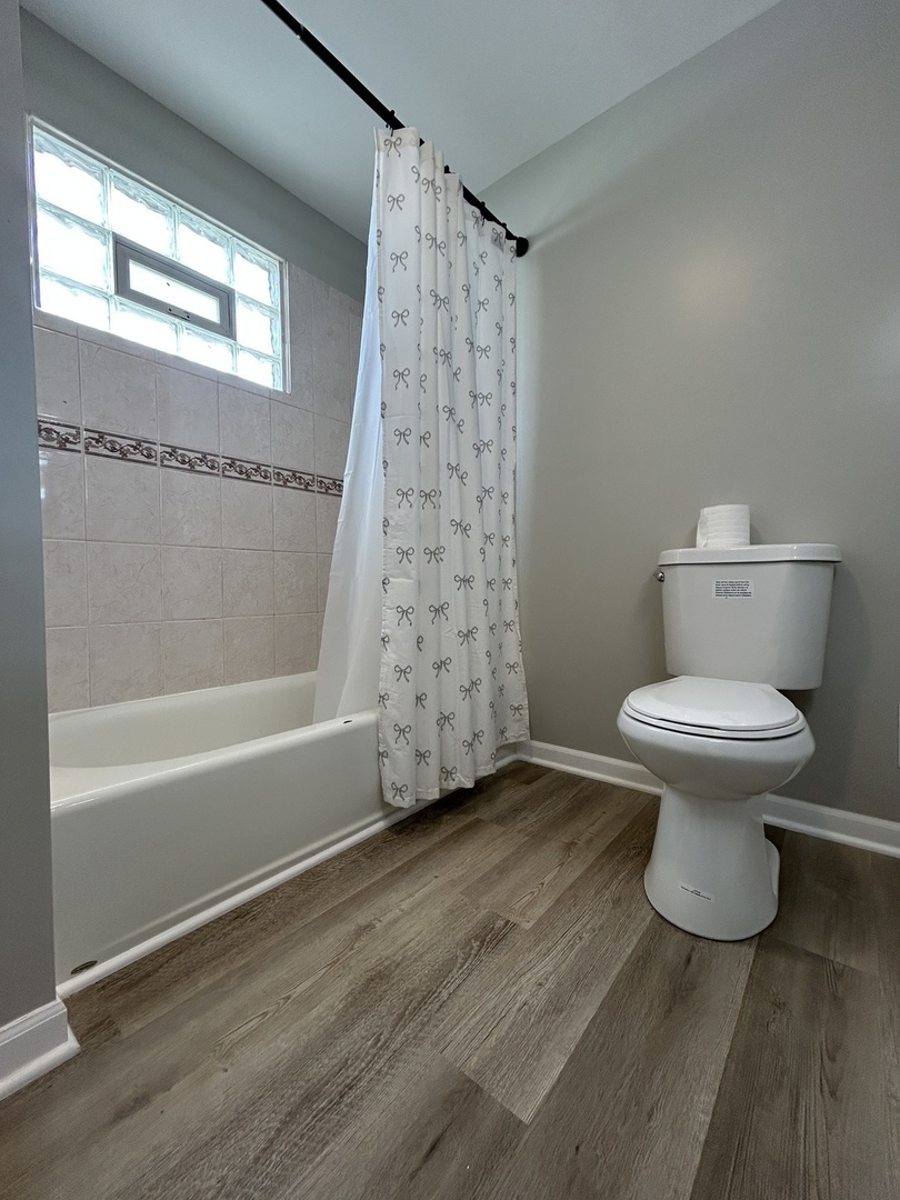 4834 North Ridgeway Avenue, Unit 3 Chicago, IL 60625 - Photo 7 of 12 a bathroom with a toilet and a shower