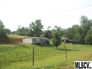 3307 Christie Road Hudson, NC 28638 - Photo 1 of 1 a view of a garden from a lake