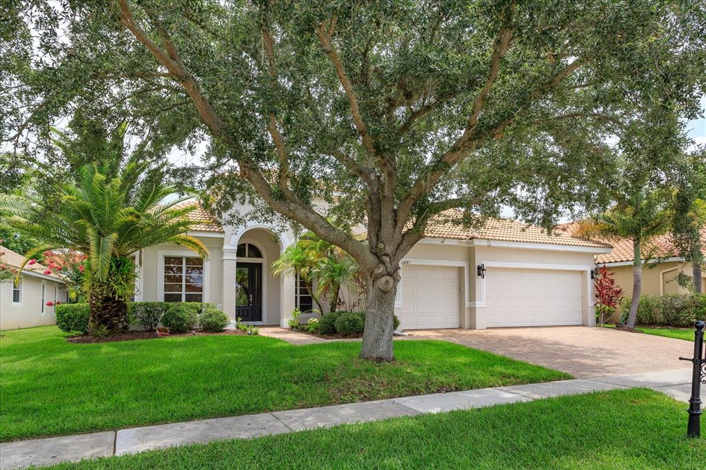 11445 Vicolo Loop Windermere, FL 34786 - Photo 1 of 28 front view of a house with a yard