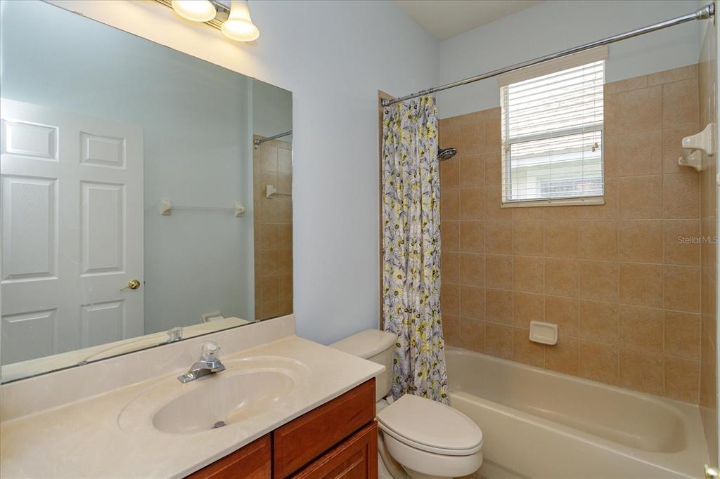 11445 Vicolo Loop Windermere, FL 34786 - Photo 20 of 28 a bathroom with a sink toilet and shower