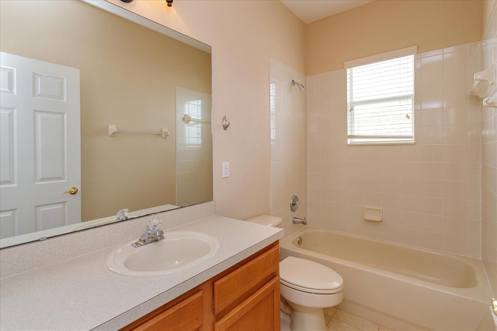 11445 Vicolo Loop Windermere, FL 34786 - Photo 22 of 28 a bathroom with a sink toilet and shower