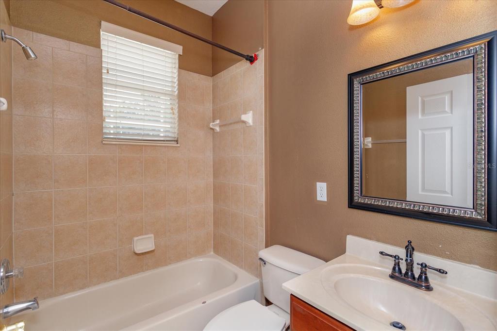 11445 Vicolo Loop Windermere, FL 34786 - Photo 24 of 28 a bathroom with a sink toilet and shower