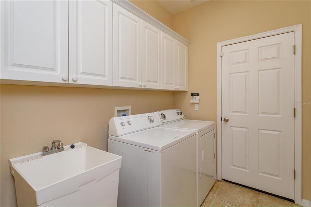 11445 Vicolo Loop Windermere, FL 34786 - Photo 25 of 28 a utility room with dryer and washer