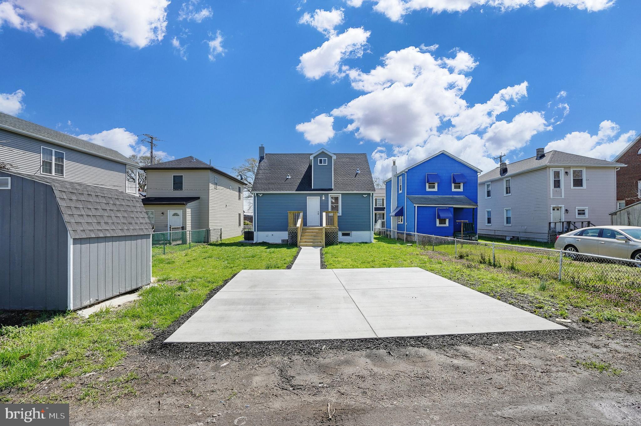 210 Sollers Point Road Dundalk, MD 21222 - Photo 25 of 26 a view of a house with a yard and potted plants