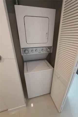 a spacious bedroom with a large bed and a large window