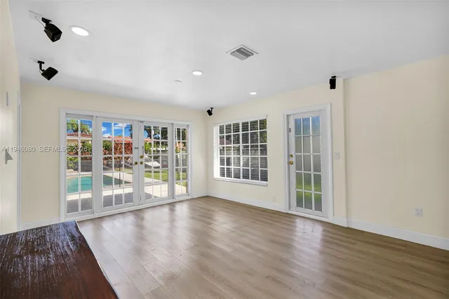 a bathroom with a toilet a sink and a window
