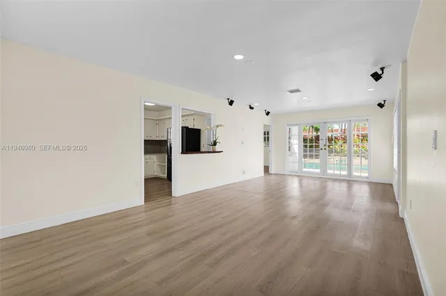 a view of a house with backyard sitting area and swimming pool