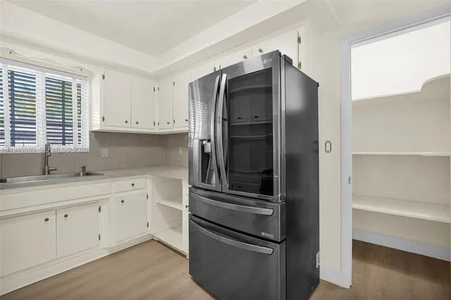 a view of a house with swimming pool and a small yard