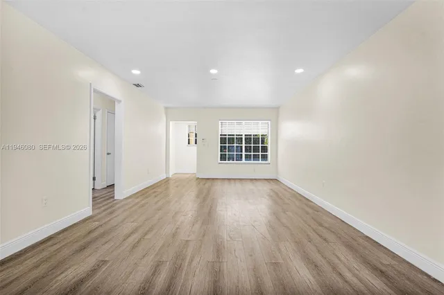a kitchen with stainless steel appliances cabinets and a refrigerator