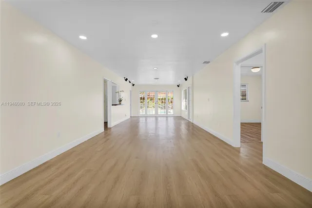 a kitchen with stainless steel appliances granite countertop a stove a refrigerator and a sink