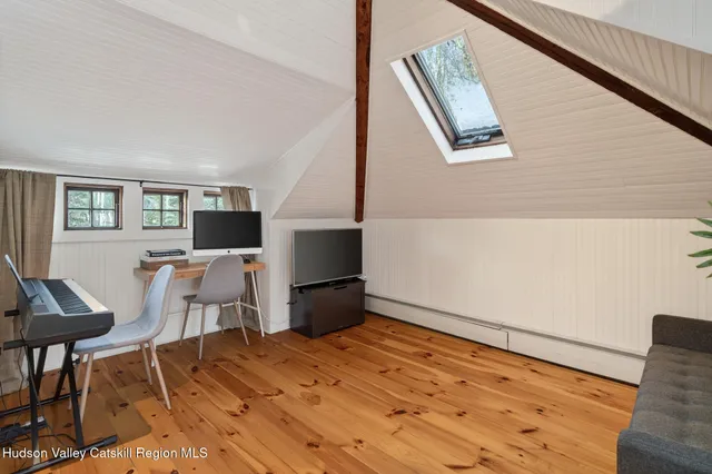 a view of kitchen with furniture and wooden floor