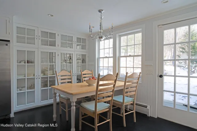 a view of a dining room with furniture window and outside view