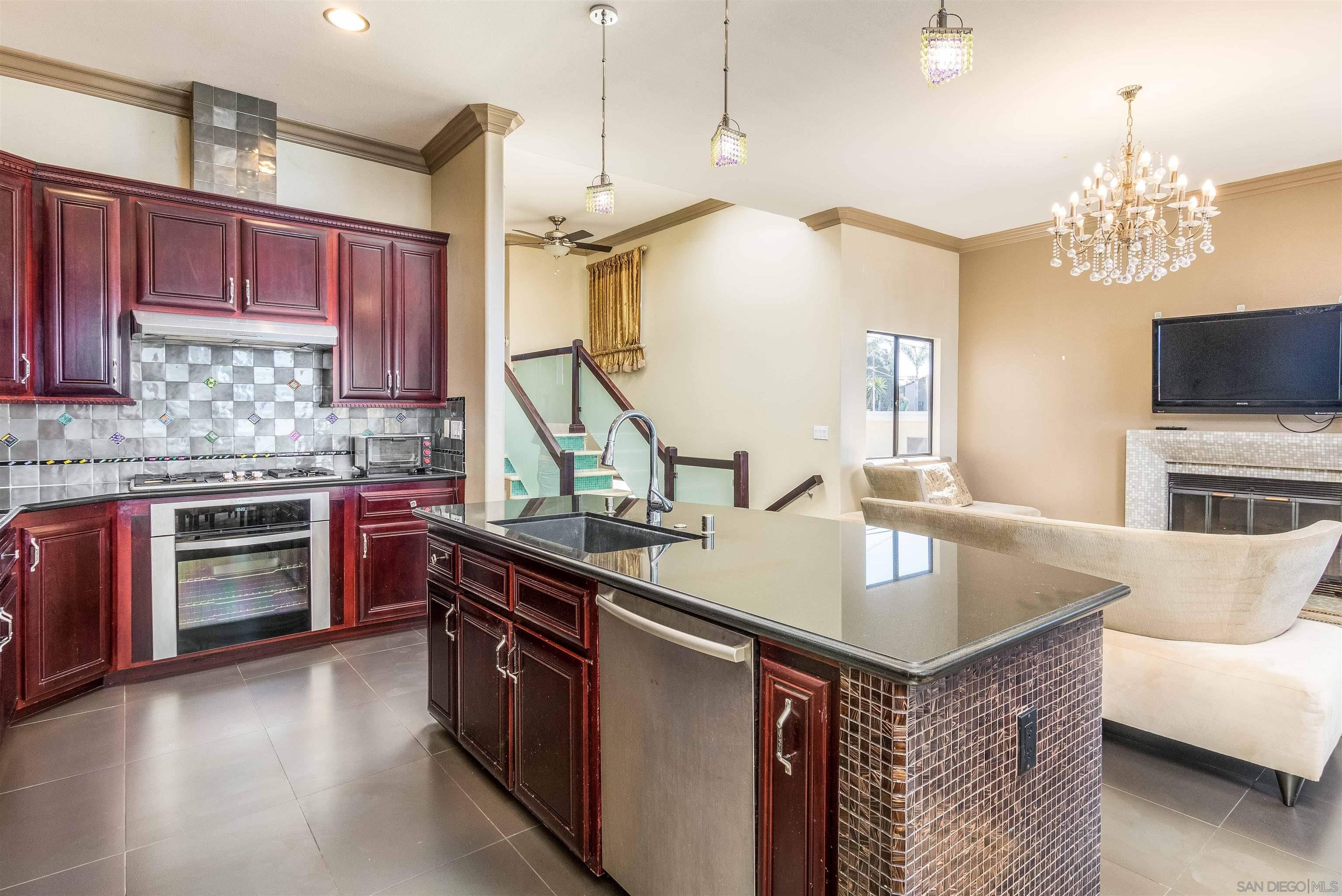 1528 Summit Avenue Encinitas, CA 92007 - Photo 11 of 21 a kitchen with stainless steel appliances granite countertop a sink a stove and a wooden floors