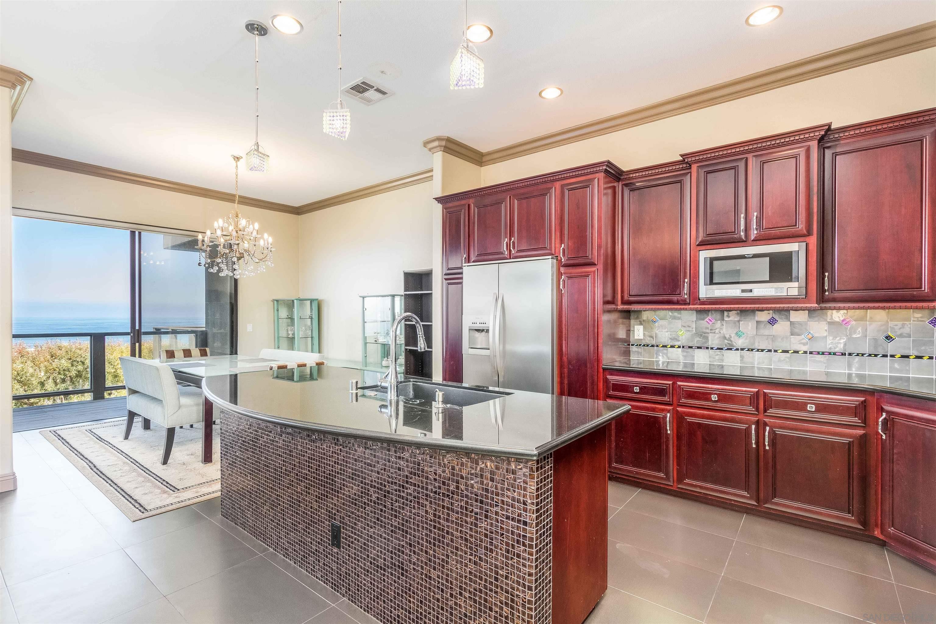 1528 Summit Avenue Encinitas, CA 92007 - Photo 12 of 21 a kitchen with stainless steel appliances granite countertop a sink a stove and a refrigerator