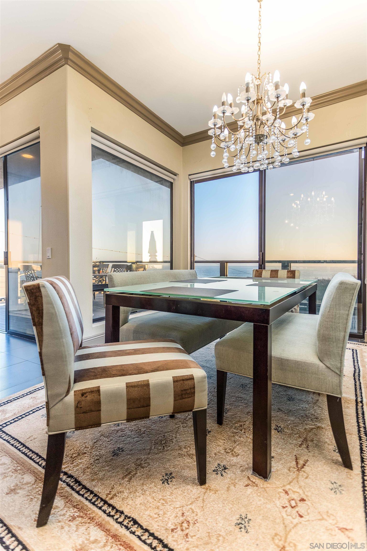 1528 Summit Avenue Encinitas, CA 92007 - Photo 14 of 21 a view of a dining room with furniture and a chandelier