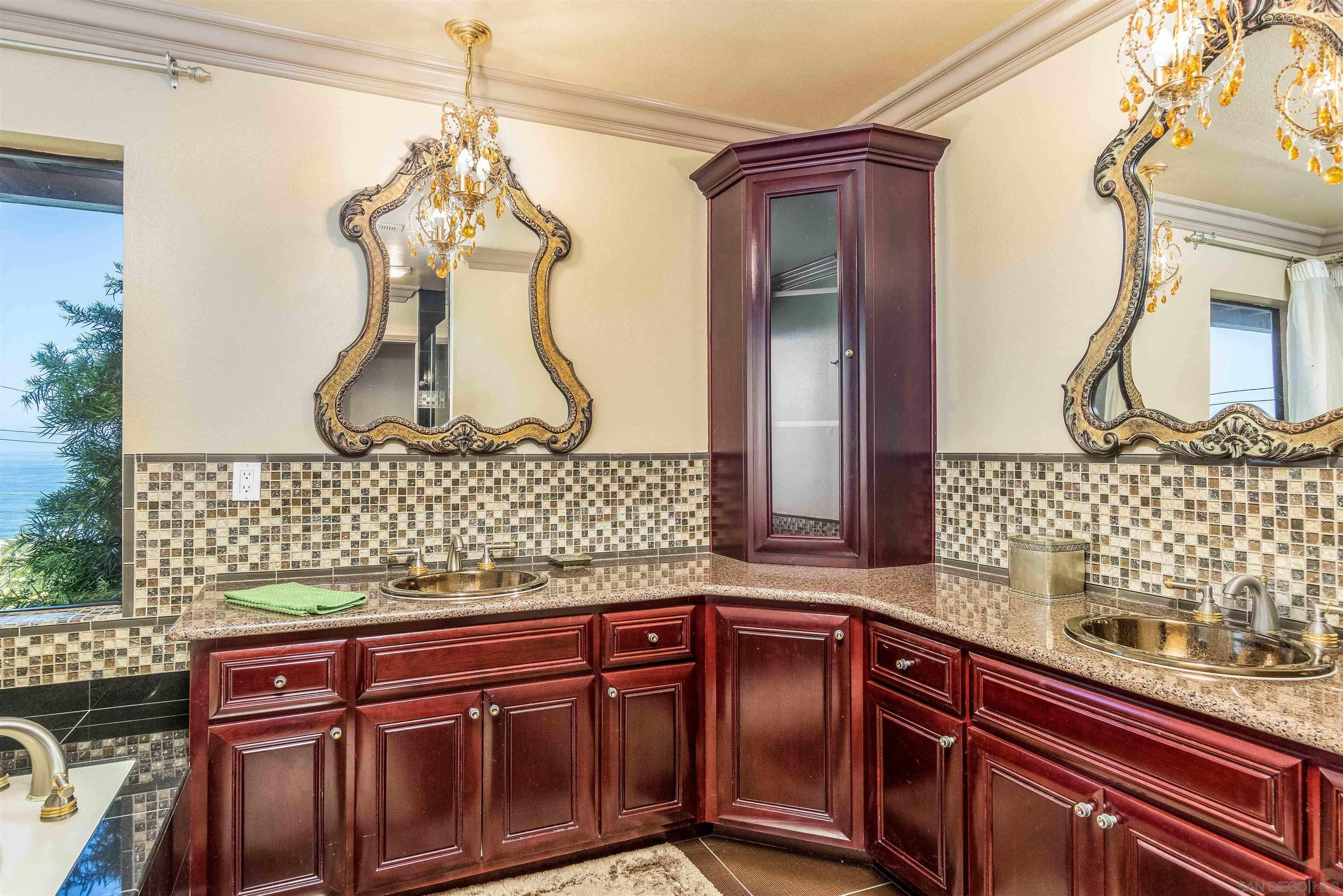 1528 Summit Avenue Encinitas, CA 92007 - Photo 16 of 21 a bathroom with a sink and mirror