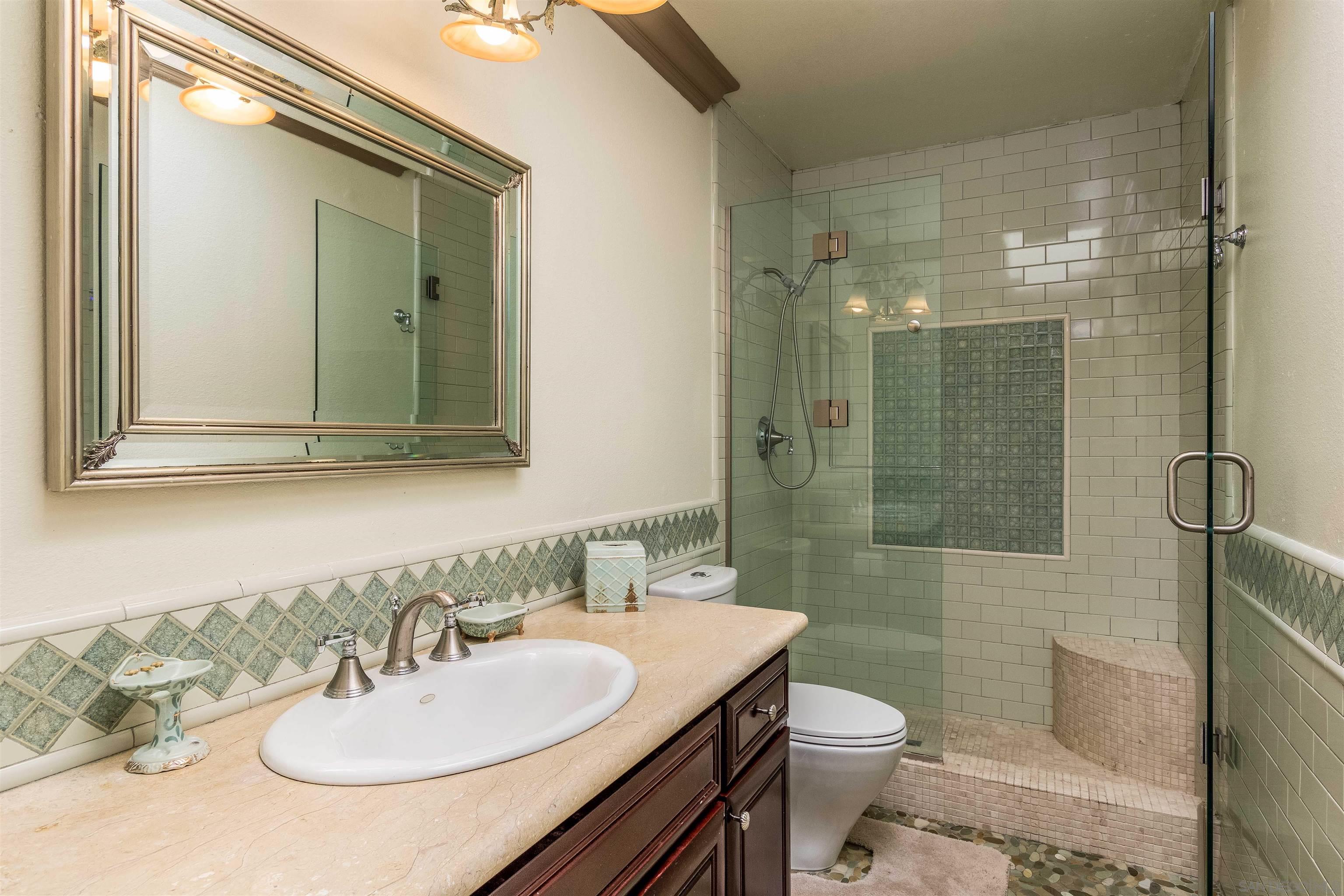 1528 Summit Avenue Encinitas, CA 92007 - Photo 17 of 21 a bathroom with a sink a toilet and shower