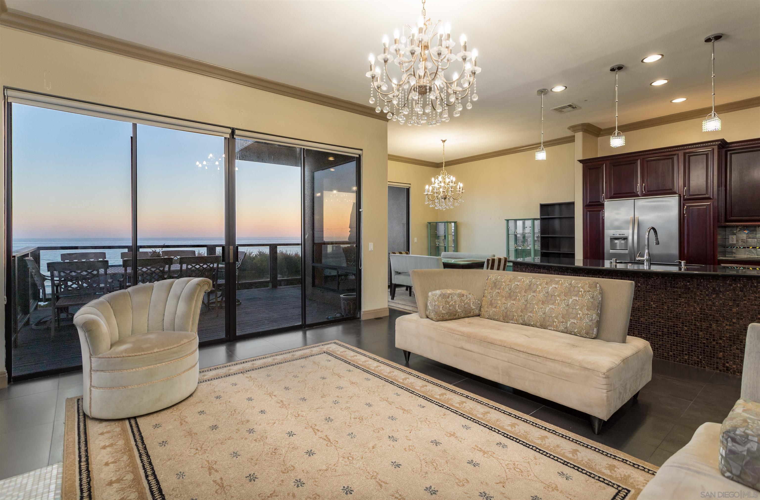 1528 Summit Avenue Encinitas, CA 92007 - Photo 5 of 21 a living room with furniture and a chandelier