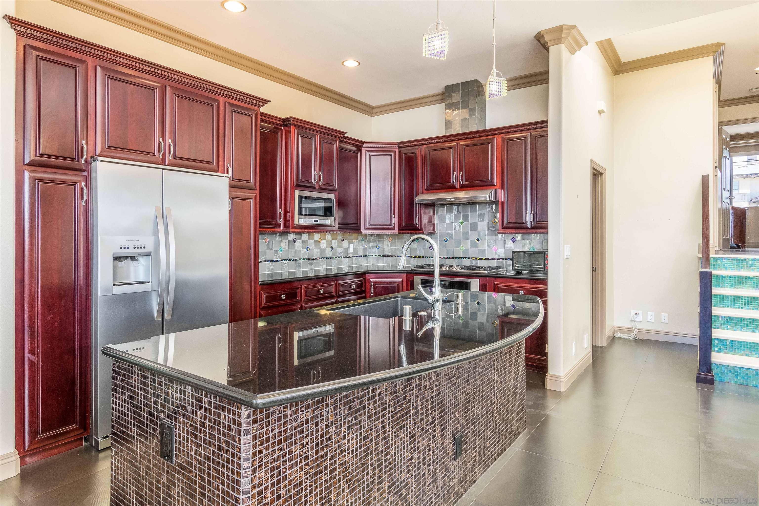 1528 Summit Avenue Encinitas, CA 92007 - Photo 9 of 21 a kitchen with stainless steel appliances granite countertop a refrigerator a sink and a stove