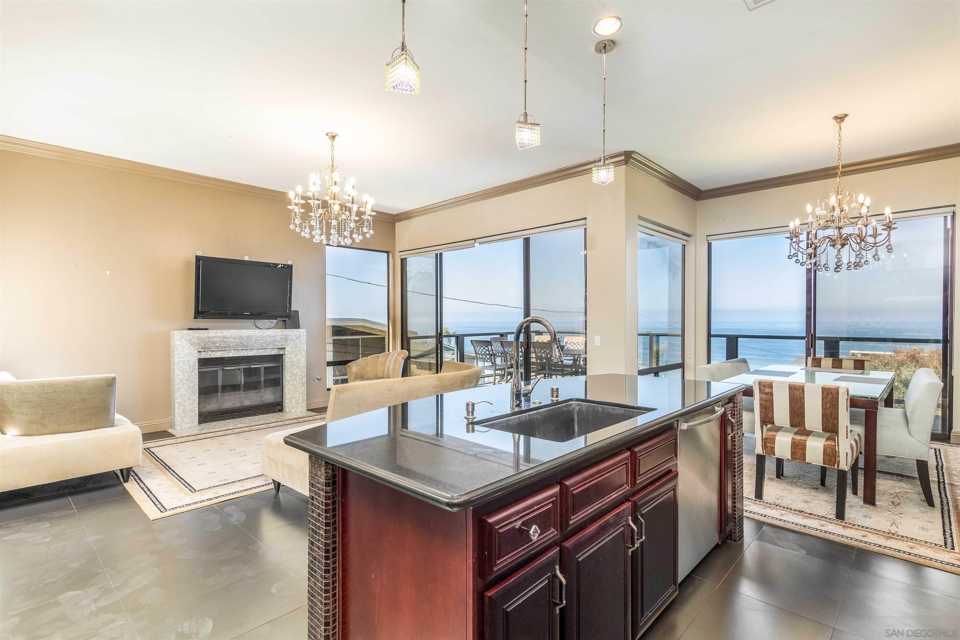 1528 Summit Avenue Encinitas, CA 92007 - Photo 10 of 21 a living room with fireplace furniture and a flat screen tv