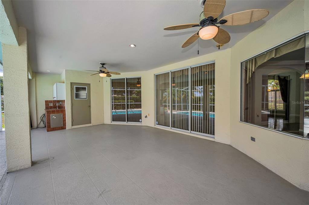 11917 Hadleigh Way Trinity, FL 34655 - Photo 41 of 84 a view of an empty room with a window and kitchen view