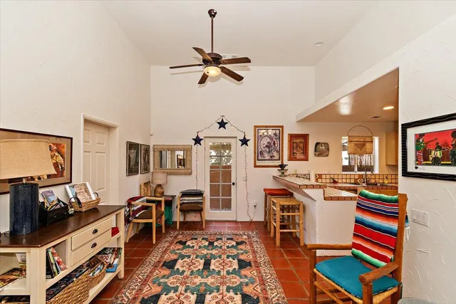 a room with furniture a flat screen tv and a table