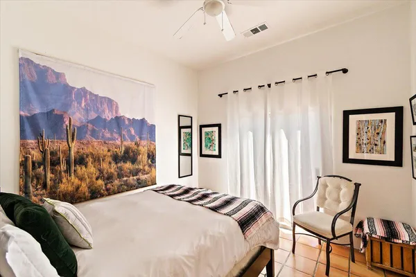 a bedroom with a bed and a window