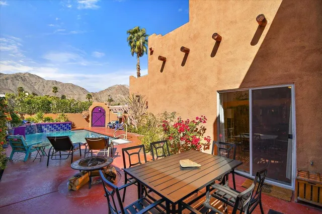 a view of a tables and chairs on the roof deck