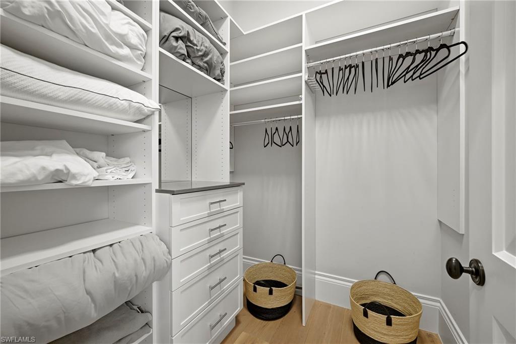 215 3rd Avenue North Naples, FL 34102 - Photo 26 of 47 Walk in closet with light wood-type flooring