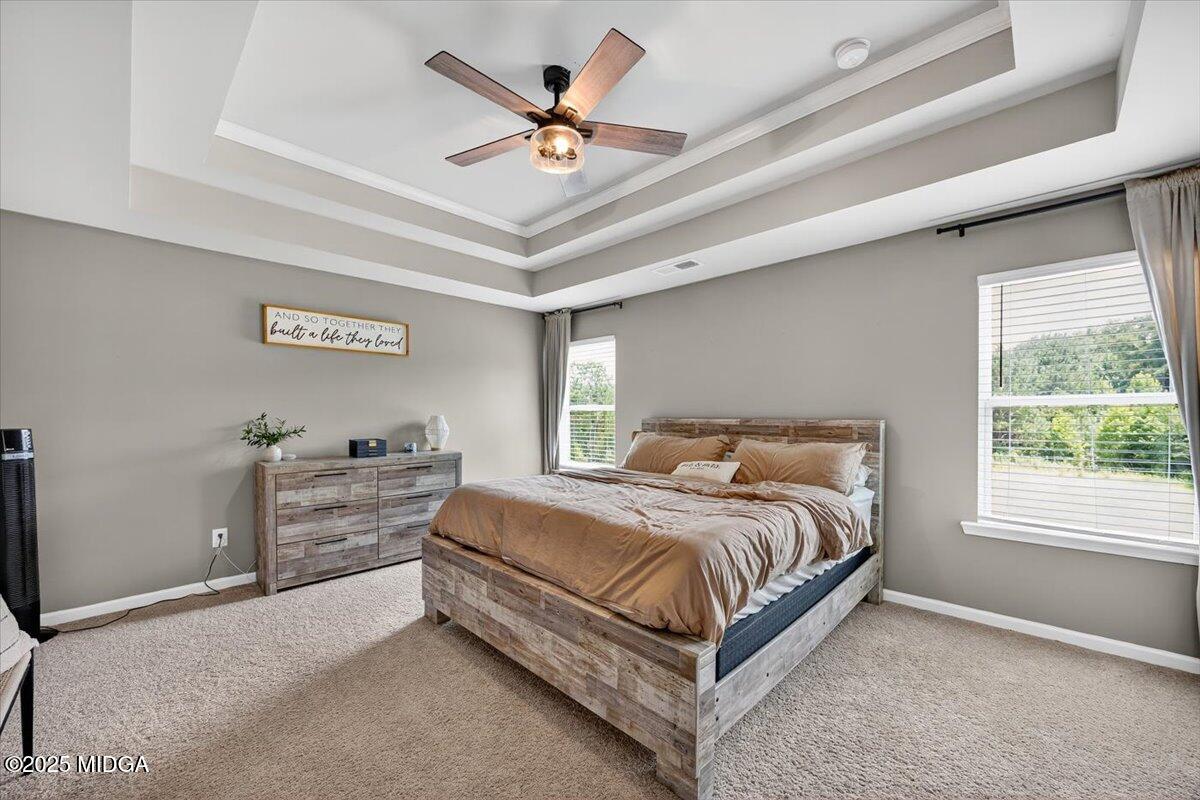 656 Dolly Drive Forsyth, GA 31029 - Photo 15 of 30 a bedroom with a bed and window