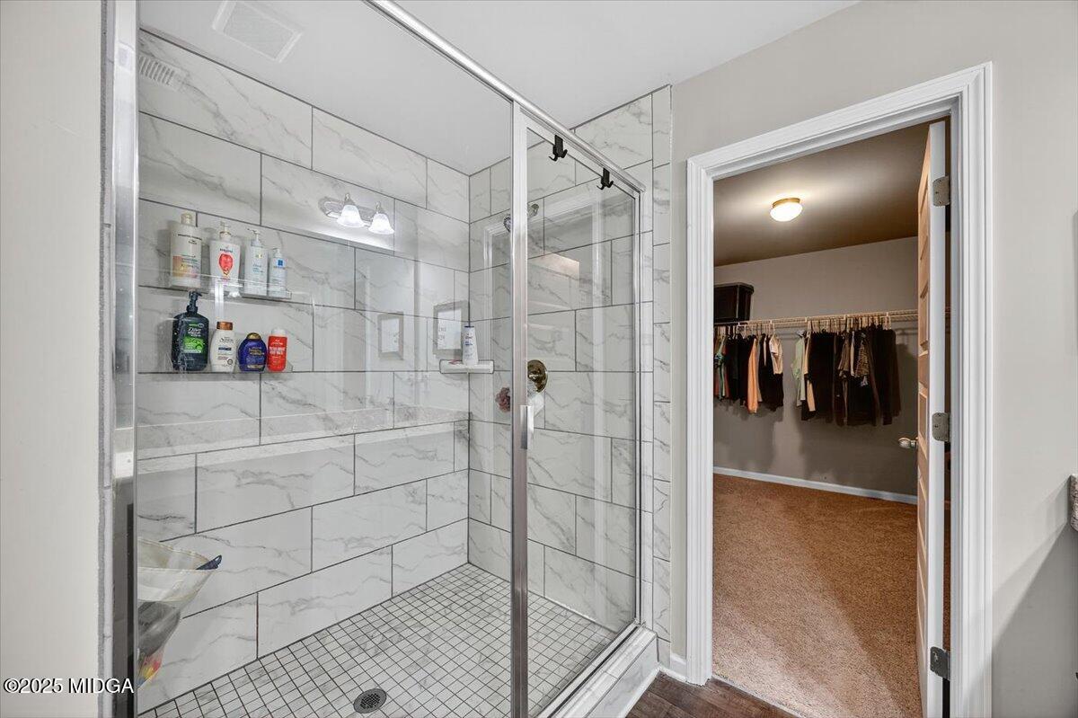 656 Dolly Drive Forsyth, GA 31029 - Photo 18 of 30 a view of a bathroom shower