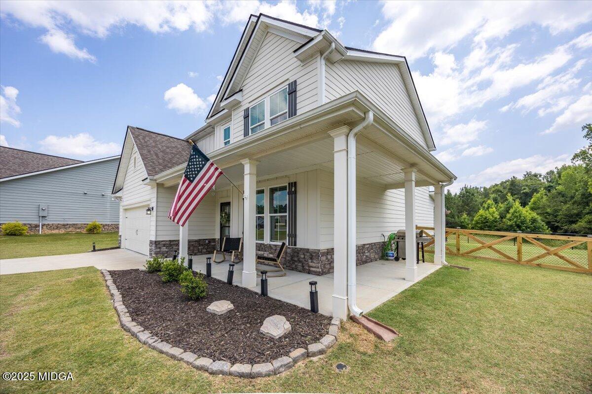 656 Dolly Drive Forsyth, GA 31029 - Photo 2 of 30 a view of a house with entertaining space