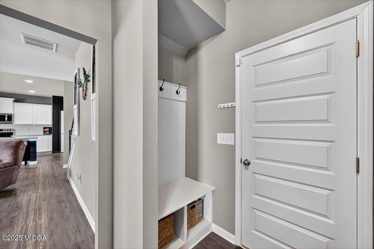 656 Dolly Drive Forsyth, GA 31029 - Photo 26 of 30 a view of a hallway with closet and a living room