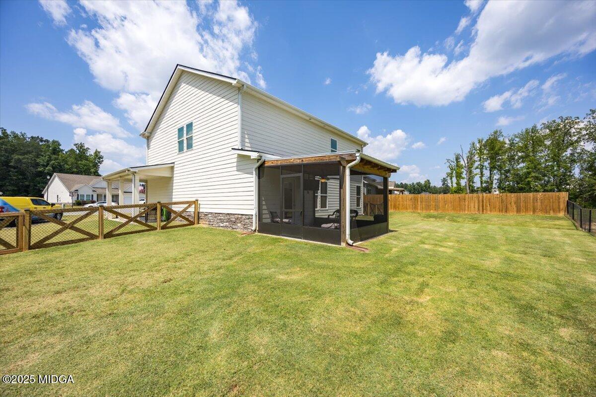656 Dolly Drive Forsyth, GA 31029 - Photo 29 of 30 a view of an house with backyard and patio