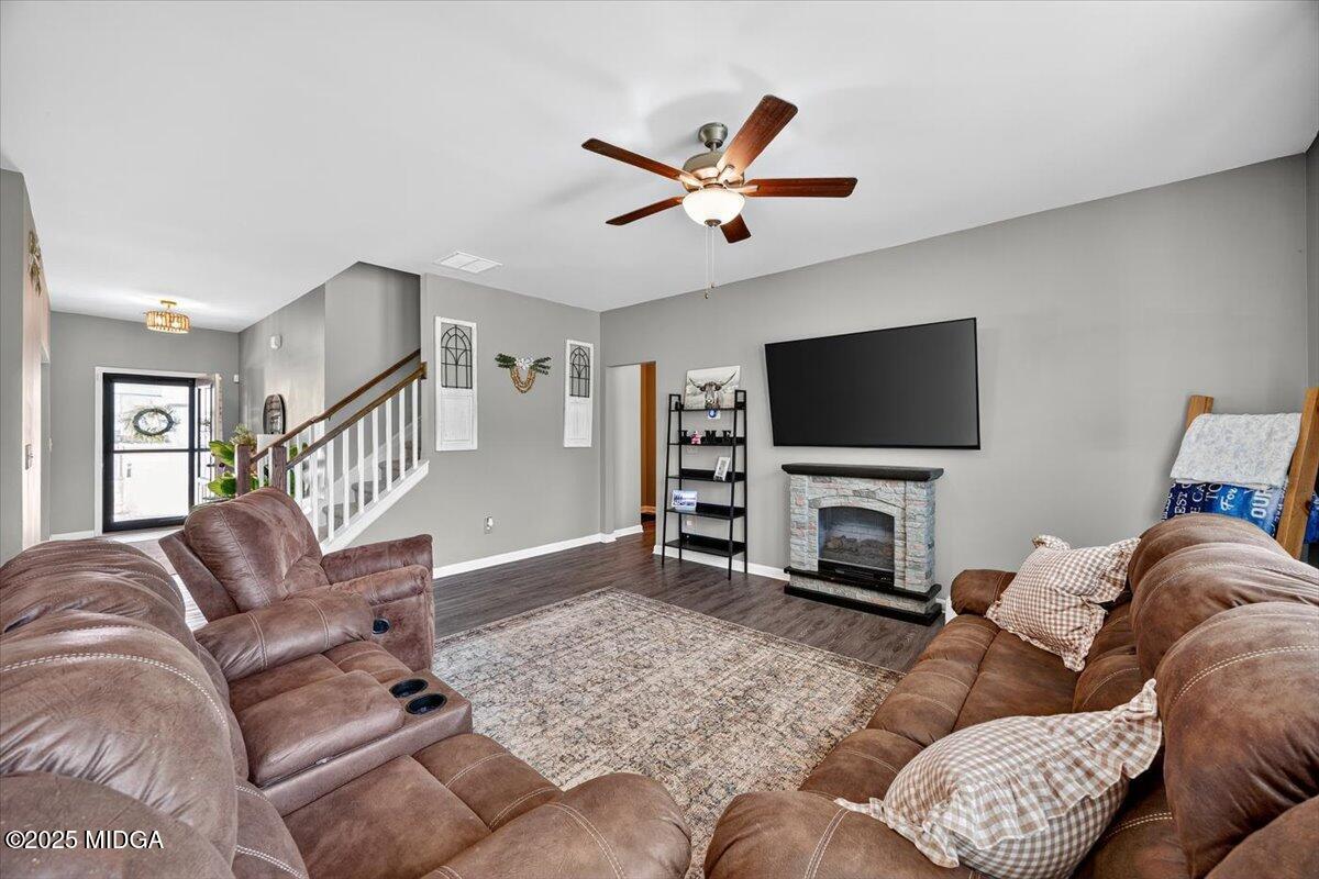 656 Dolly Drive Forsyth, GA 31029 - Photo 10 of 30 a living room with furniture and a flat screen tv