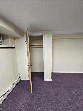 an empty room with a bathroom