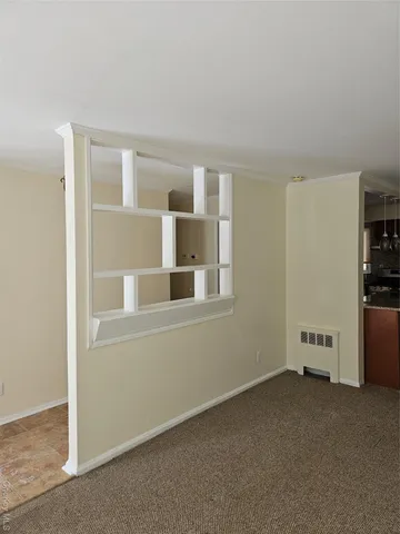 an empty room with a fireplace