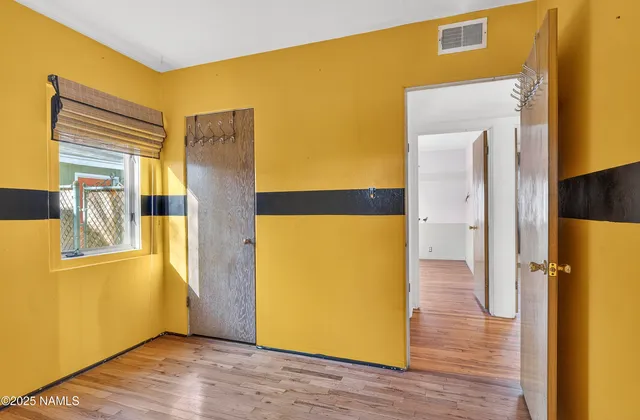 a white bath tub sitting next to a white sink and a mirror