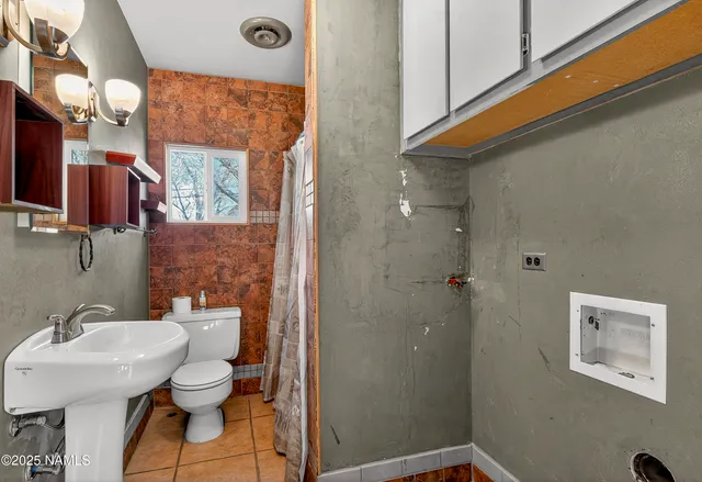 a view of a large room with wooden floor and outdoor space