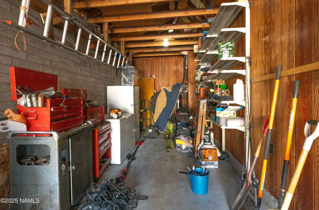 a front view of a house with a garden and trees