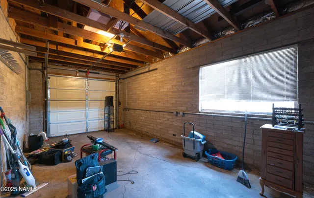 a front view of a house with a tree