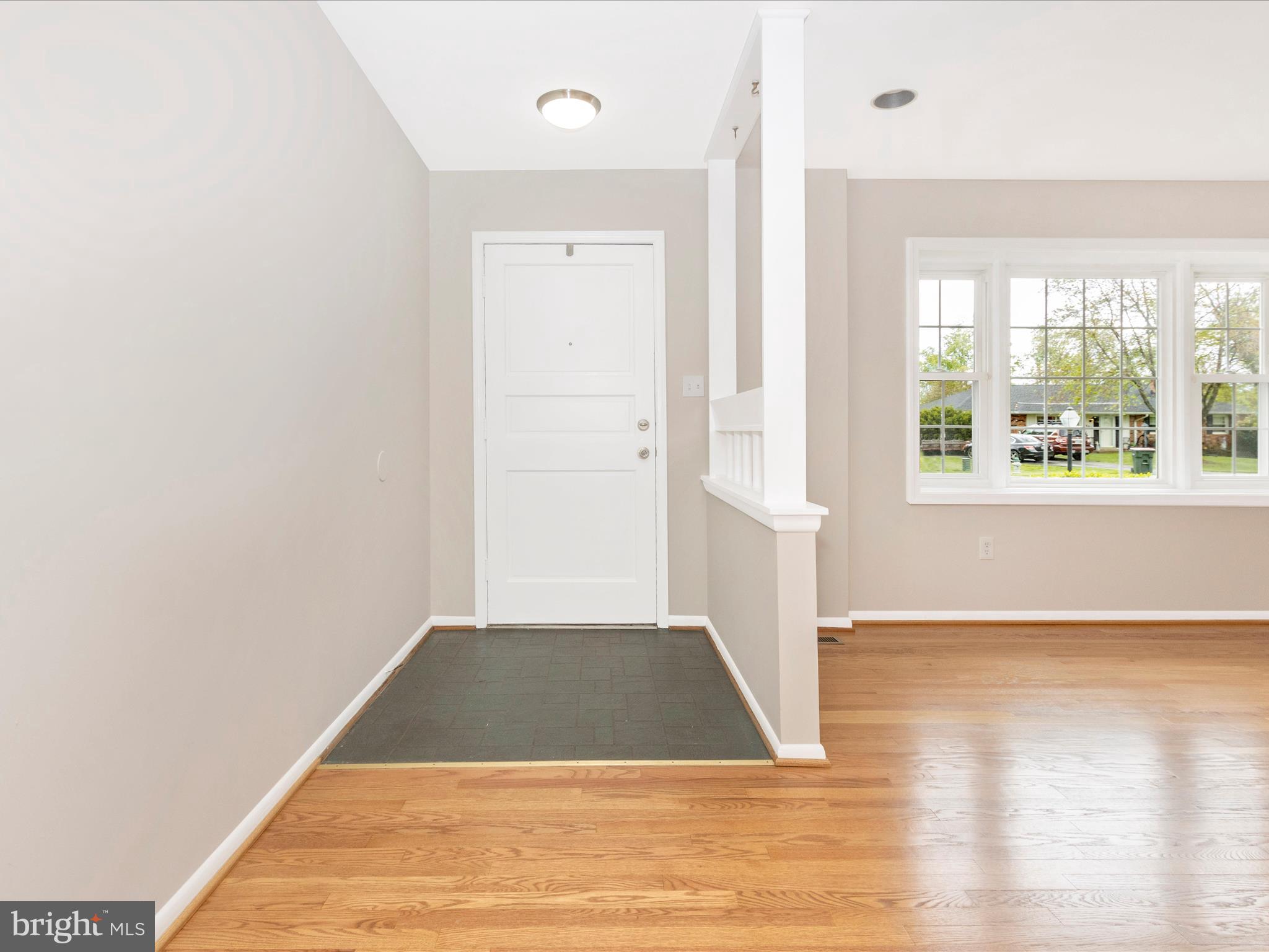 19453 Olney Mill Road Olney, MD 20832 - Photo 2 of 41 an empty room with wooden floor and windows