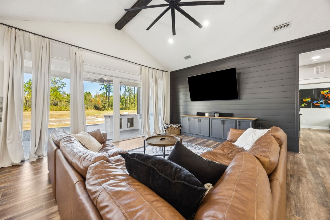 32500 Crossfire Trail Callahan, FL 32011 - Photo 12 of 64 a living room with furniture and a flat screen tv