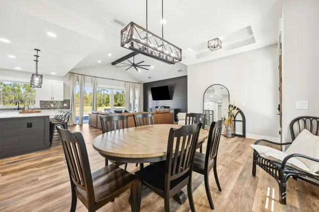 a view of a dining room with furniture window and wooden floor