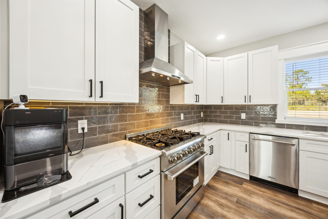 32500 Crossfire Trail Callahan, FL 32011 - Photo 20 of 64 a kitchen with stainless steel appliances granite countertop a stove a sink and a microwave