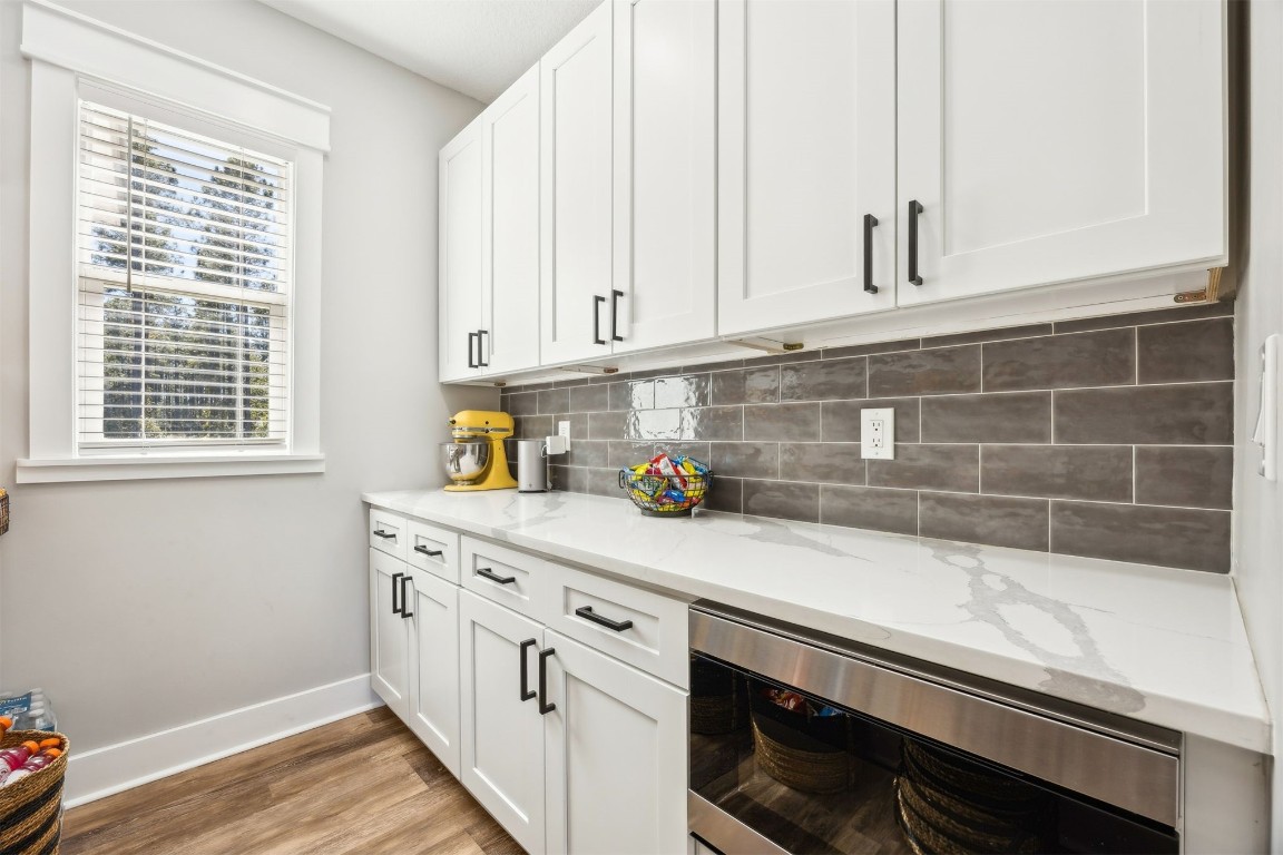 32500 Crossfire Trail Callahan, FL 32011 - Photo 23 of 64 a kitchen with stainless steel appliances white cabinets and a window